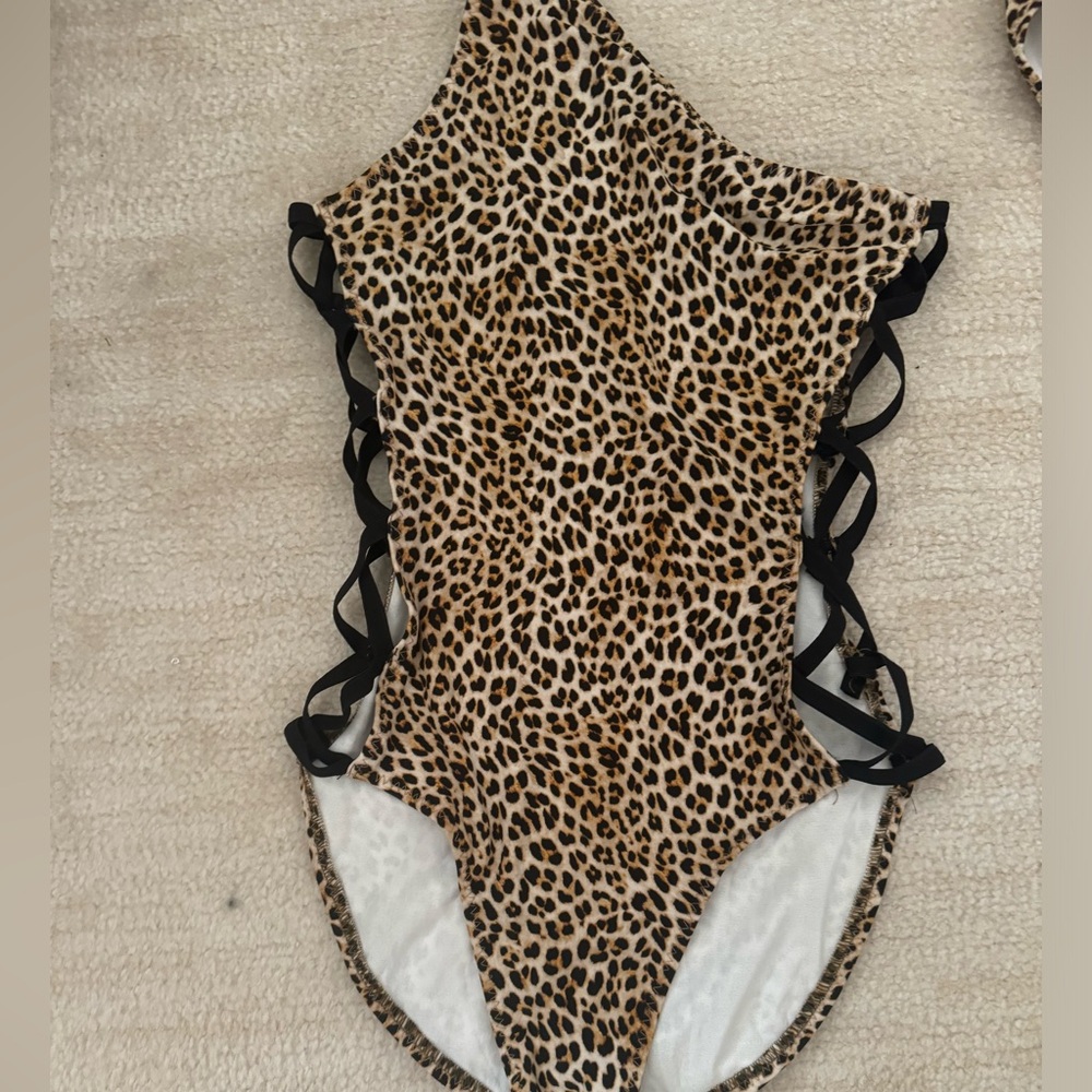 Norma kamali leopard print with side X’s